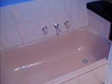 Outdated pink cast iron bath