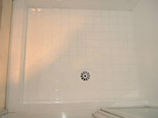 shower floor tiles after resurfacing in white
